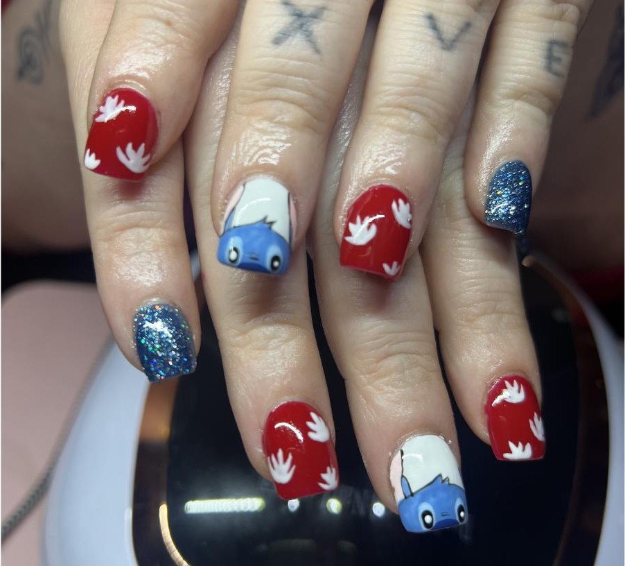 Lilo and Stitch character nail art with blue glitter accent nails